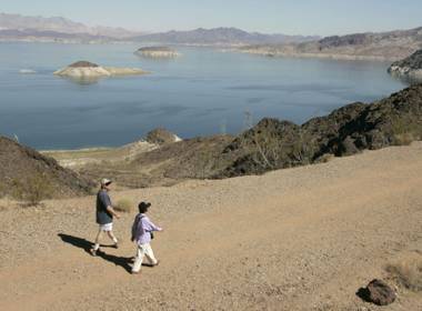 Scott Long and Ling Yee take in the scenic walk during a hike along the Railroad Tunnel trail at Lake Mead on Wednesday, Oct. 6, 2004.